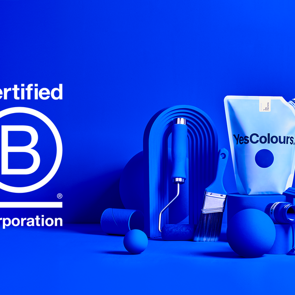 landscape photography of a paint pouch reading 'YesColours surrounded by various decorating tools and objects painted in royal blue, all photographed on a clean royal blue background