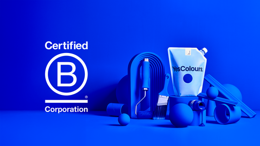 landscape photography of a paint pouch reading 'YesColours surrounded by various decorating tools and objects painted in royal blue, all photographed on a clean royal blue background